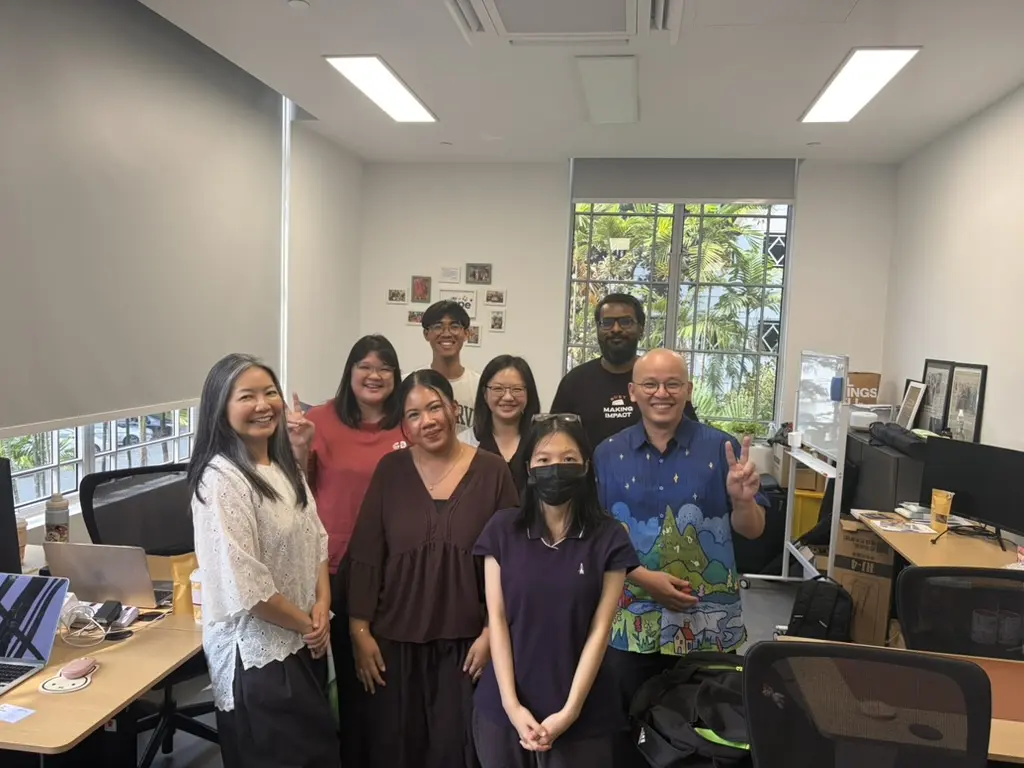 Haojun See with the Ray of Hope team in their office after the Claude training session