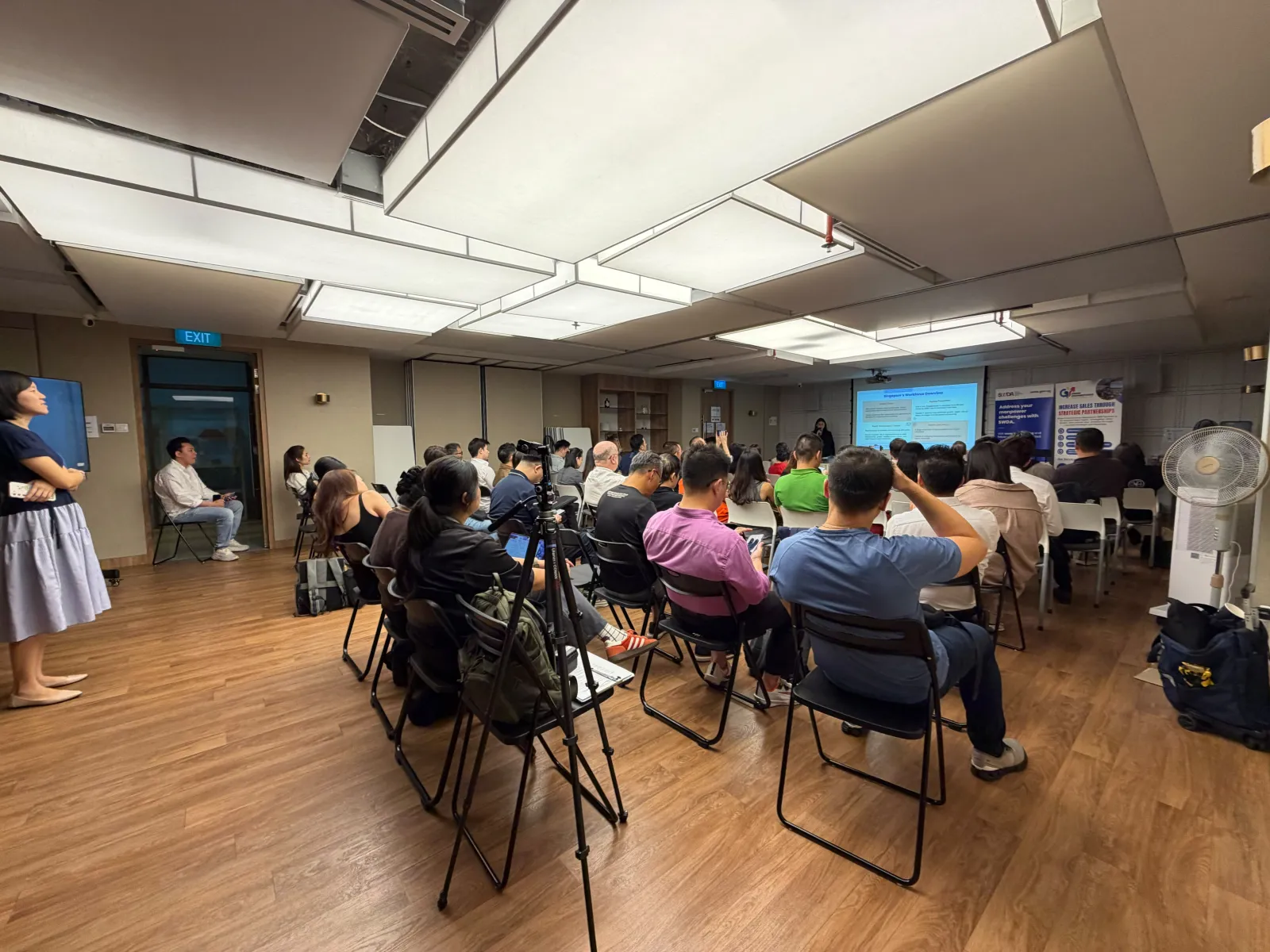 The audience at Towkay Talks Series 5 at MIT Space, facing the speaker and slides at the front of the room